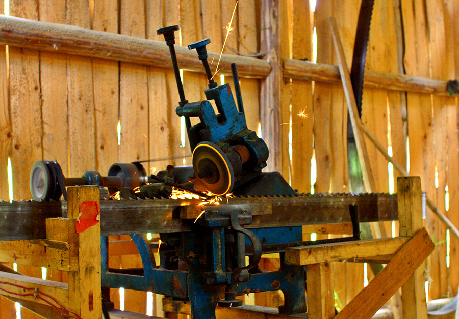 0284 Automatic sharpener used for the saw in a small local lumber mill.