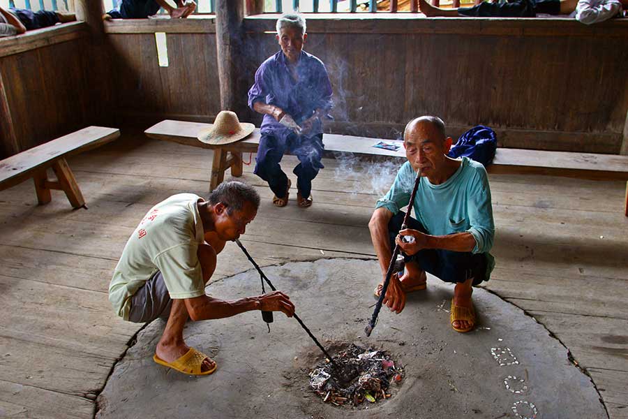 1080 Socializing while smoking pipes in a very old drum tower.