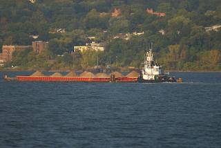 Tug pushing barge up Hudson River