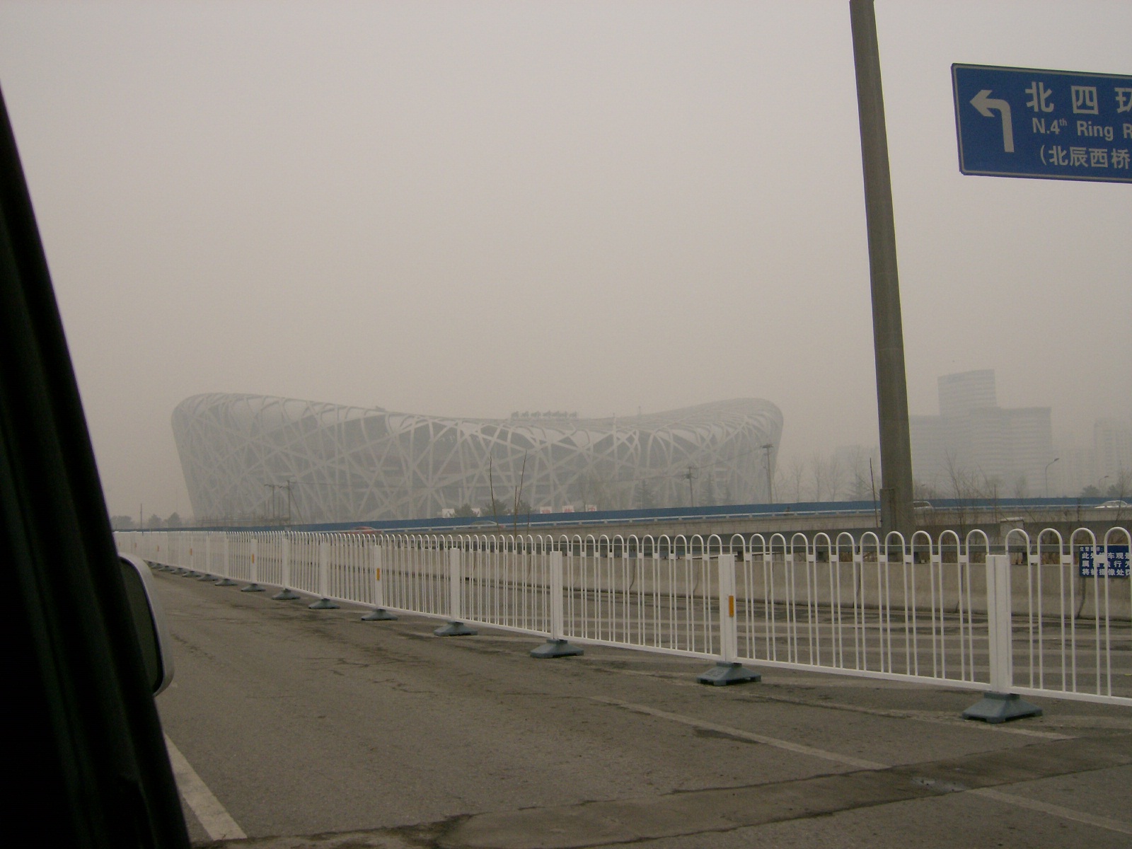 The Olympic stadium glimpsed through the murk