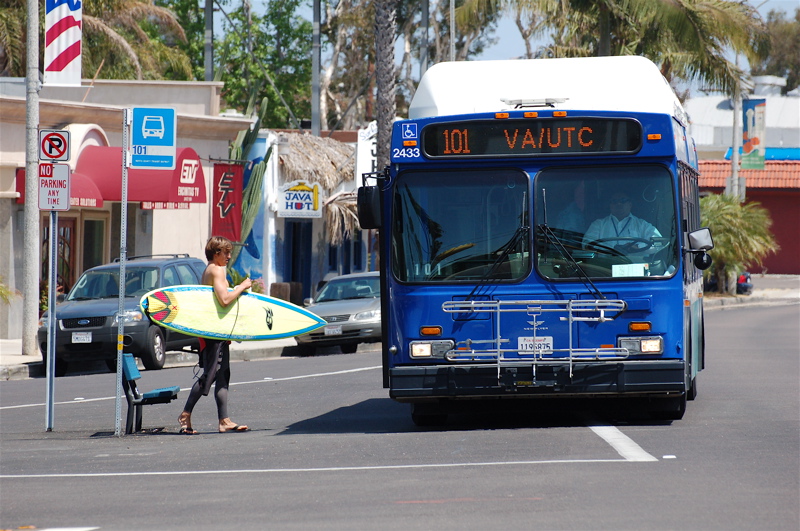 Surfer boarding the 101 Bus