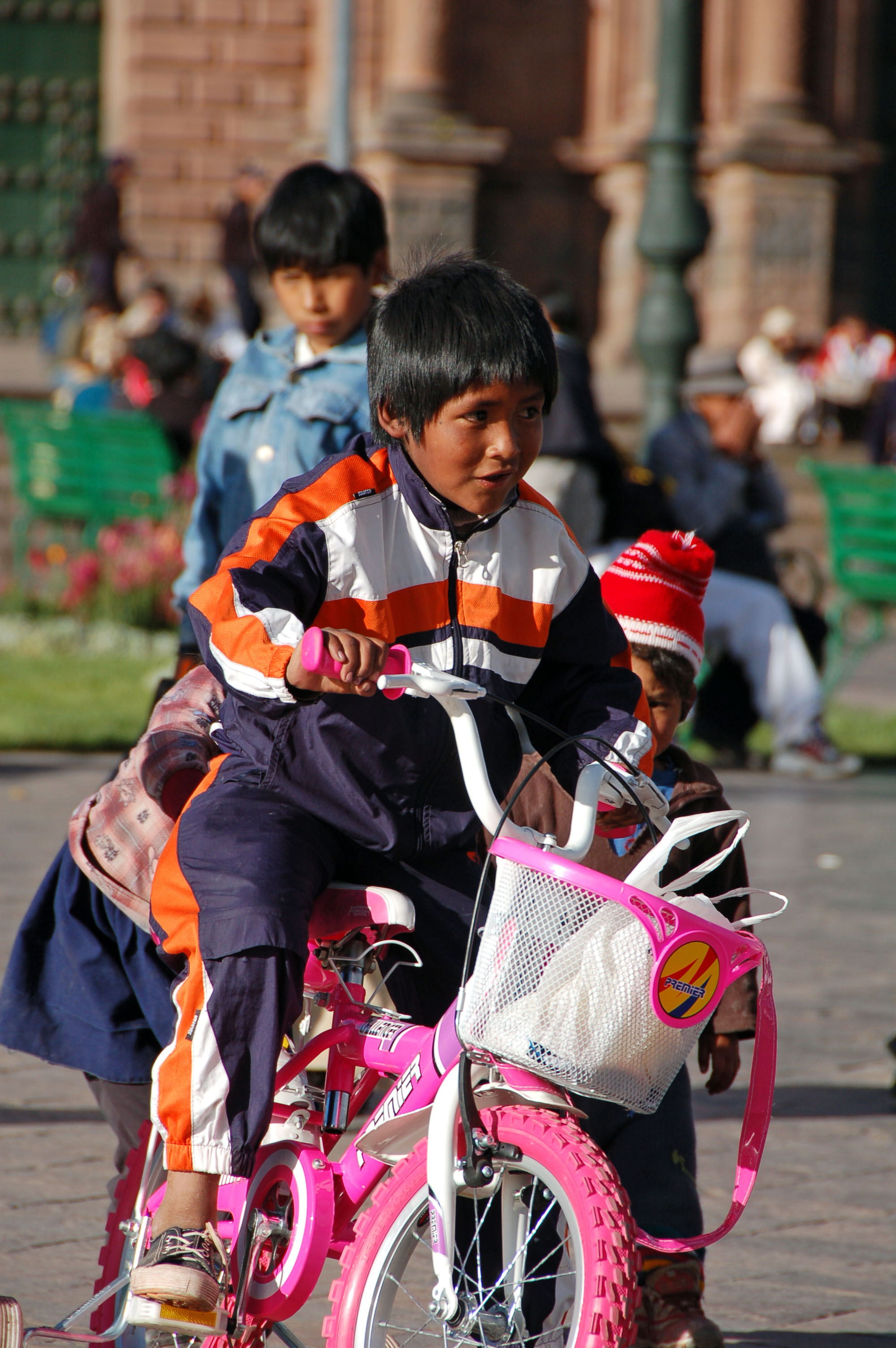 Cuzco boy on his sisters bike