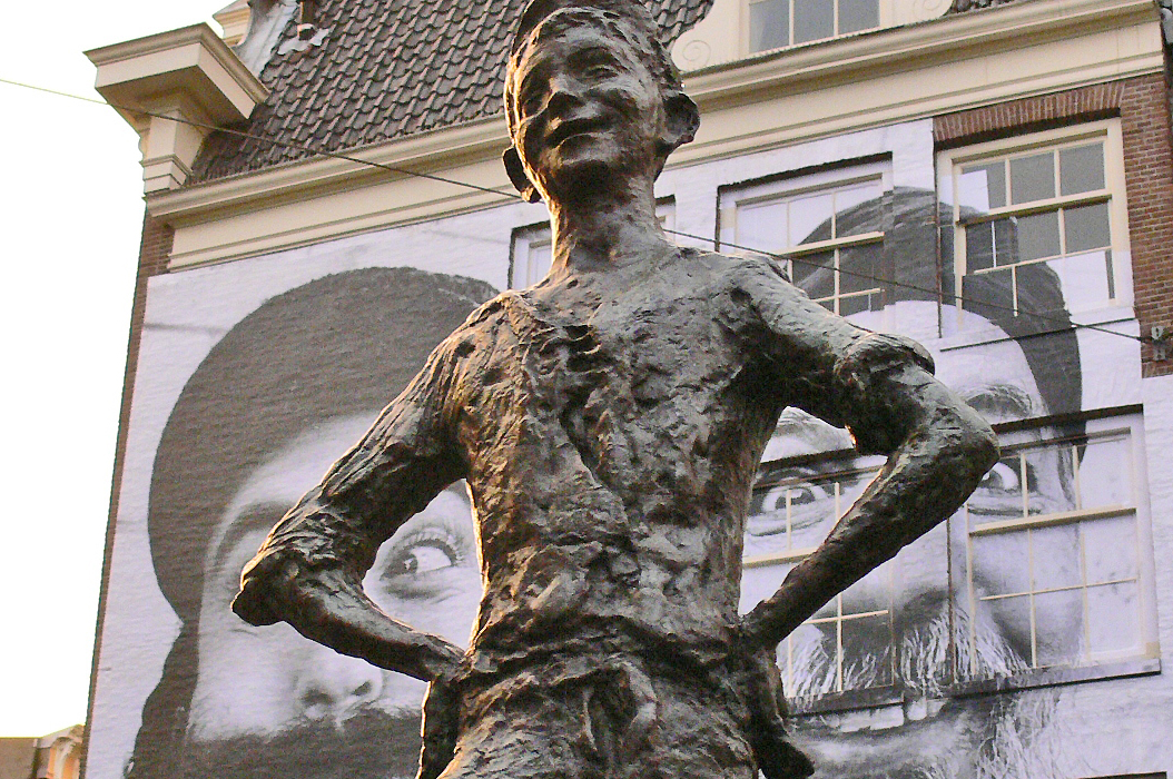 JR Litho Pasting behind BoyStatue.JPG