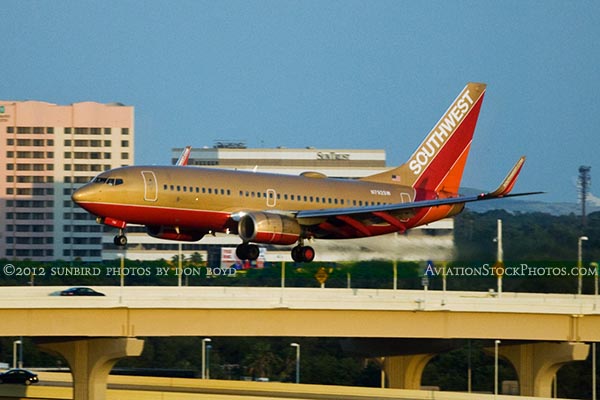 2012 - Southwest Airlines B737-7H4 N792SW in the Retro Gold scheme on approach to 1L at TPA airline aviation stock photo