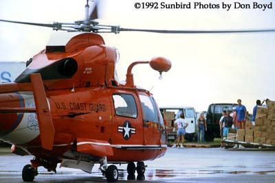 1992 - Coast Guard operations after Hurricane Andrew - HH-65 and volunteers loading supplies