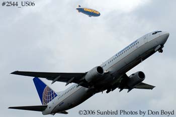 Continental Airlines B737-924 N72405 with Goodyear Blimp in background airline aviation stock photo #2544