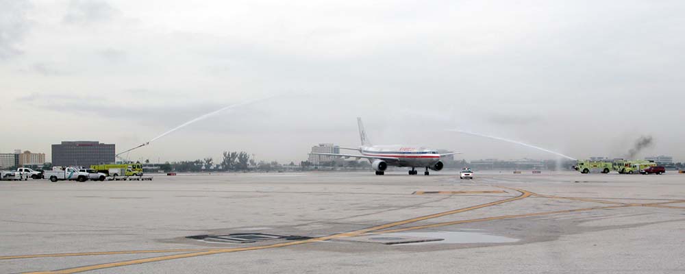 MIA ARFF units honor the return of a fallen soldier with a water cannon salute photo #2113