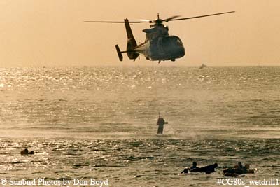 Late 80's - USCG HH-65 #6525 hoisting Coast Guard Reserve air crew members during wet drill