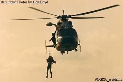 Late 80's - USCG HH-65 #6525 hoisting Coast Guard Reserve air crew member during wet drill