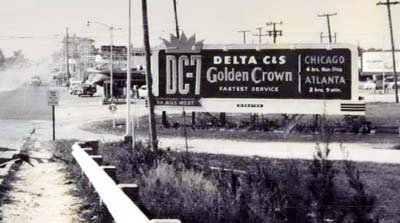 1955 - Delta C&S DC-7 Golden Crown billboard on NW 36th Street in Miami