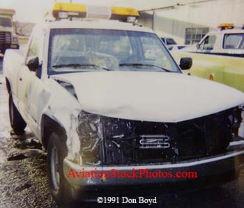 1991 - damaged ramp car after collision with Piper PA28-151 N41306 at Miami International Airport