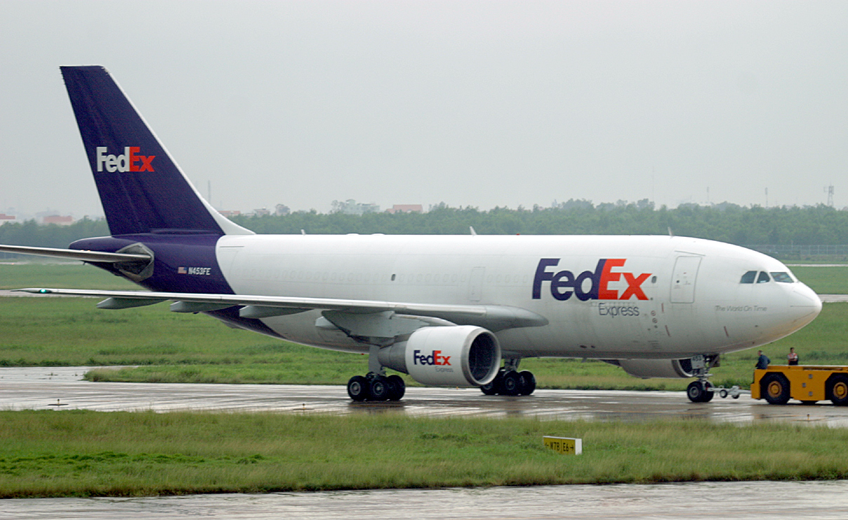 Fedex A-310 being towed at SGN
