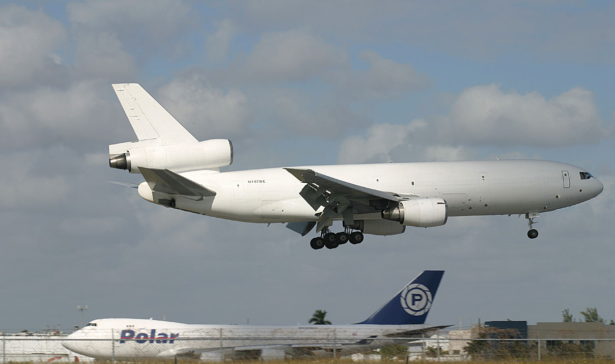 An un-titled cargo DC-10 lands in MIA RWY 9, while Polar Airs 747-400 taxied for takeoff.