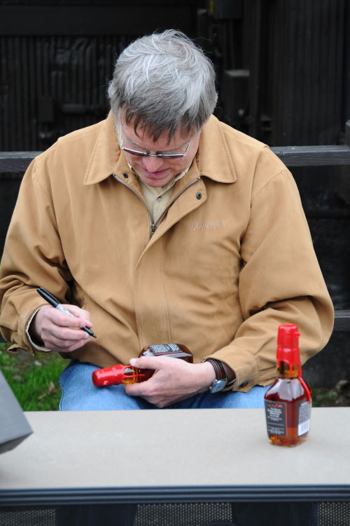 Bill Samuels signing the Makers Mark Bottles