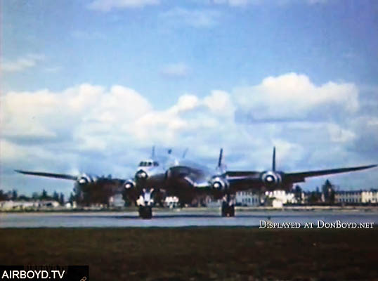 1953 - Eastern Air Lines Super Constellation taxiing out to runway 9R at MIA with MIAD building in the background