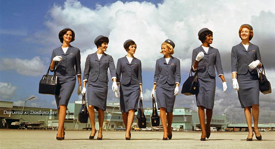 1965 - Delta stewardesses modeling their uniforms on the ramp east of Concourse 1 (now H) at Miami International Airport
