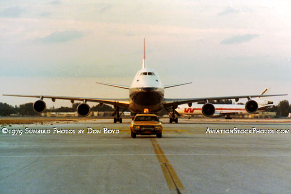 1979 - one of my buddies escorting the daily British Airways B747-100 to the gate at MIA with a Western DC-10 in the background