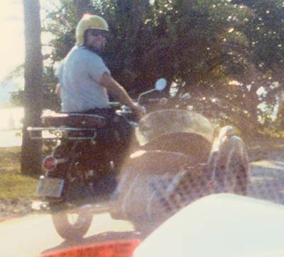 1976 - LCDR Clay Drexler on his motorcycle with sidecar