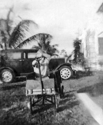 1936 - Burl Greys younger brother in front of his dads 1931 Graham car, 2123 NW 44 Street, Miami