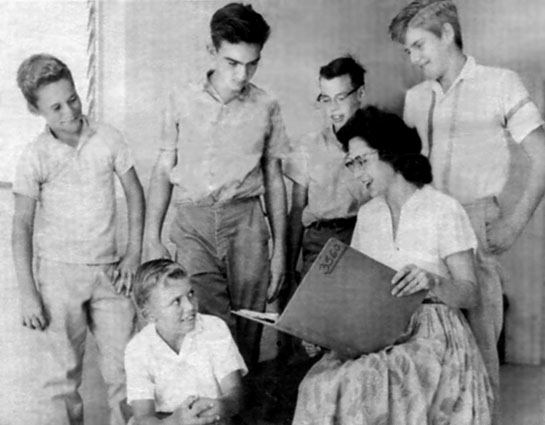 1962 - Marlene Harden, Miami News counselor, with a group of her Miami News paperboys