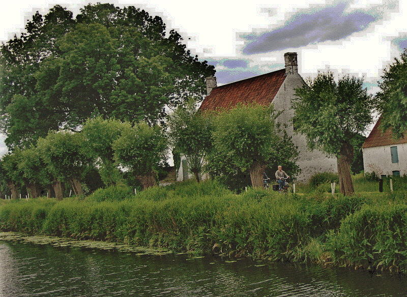 CYCLIST BESIDE CANAL