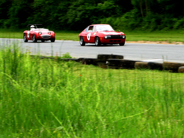 1959 Austin-Healey Sprite, left, and 1967 Lancia Fulvia S in the 2006 Jefferson 500 at Summit Point Raceway in West Virginia.
