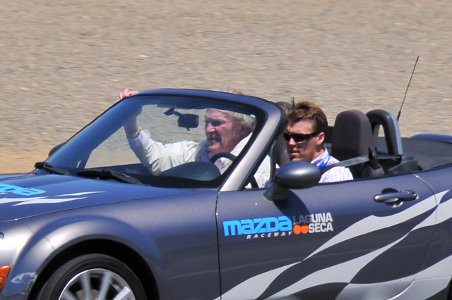 Dan Gurney, 79, being driven by son Alex around the Mazda Raceway Laguna Seca in a Mazda MX-5 Miata (2813)