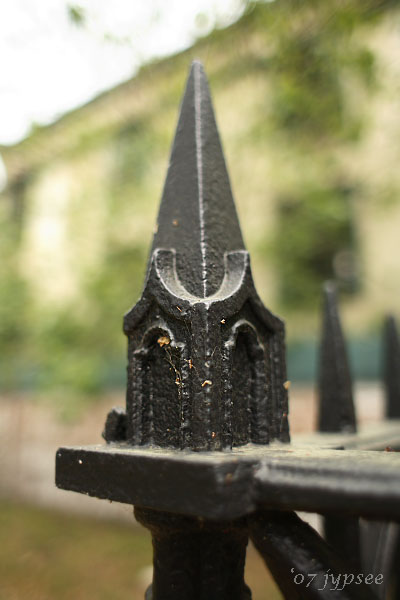 finial on rail surrounding gravesite