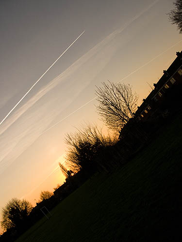 Aircraft trails at sunset
