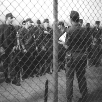 SSgt Rick Yale (back to camera) conducts guardmount. Around August 1969