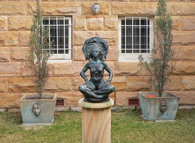 A Bronze, Three Faces and Sandstone