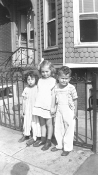 L to R: Cousins Susan & Marilyn, & Richard in front grandma Anna & grandpa Louis' (mother's side) house - Brooklyn (1946)