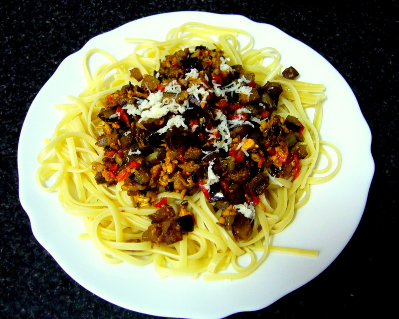 linguine with sauteed eggplant, garlic, red peppers, mussels, Torres 10 yr brandy, crumbled cayenne pepper & aged sheep cheese