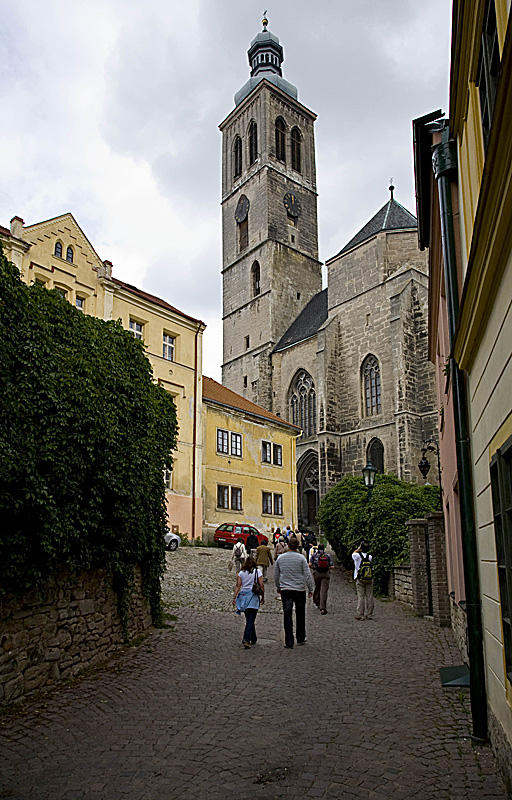 Up into daylight, town church ahead