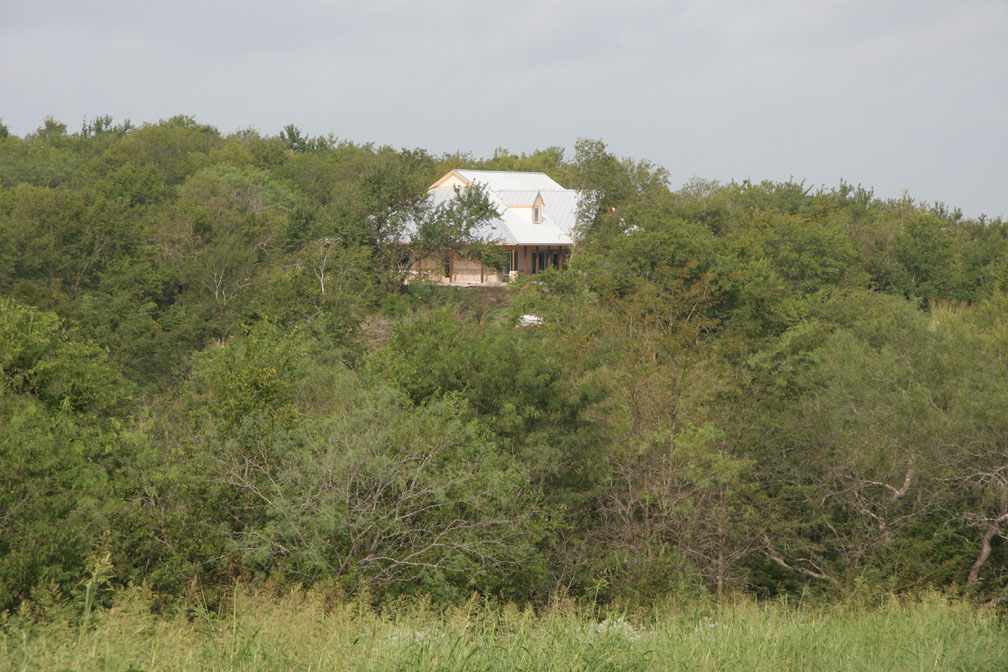 View of the new roof from the road down to the lake