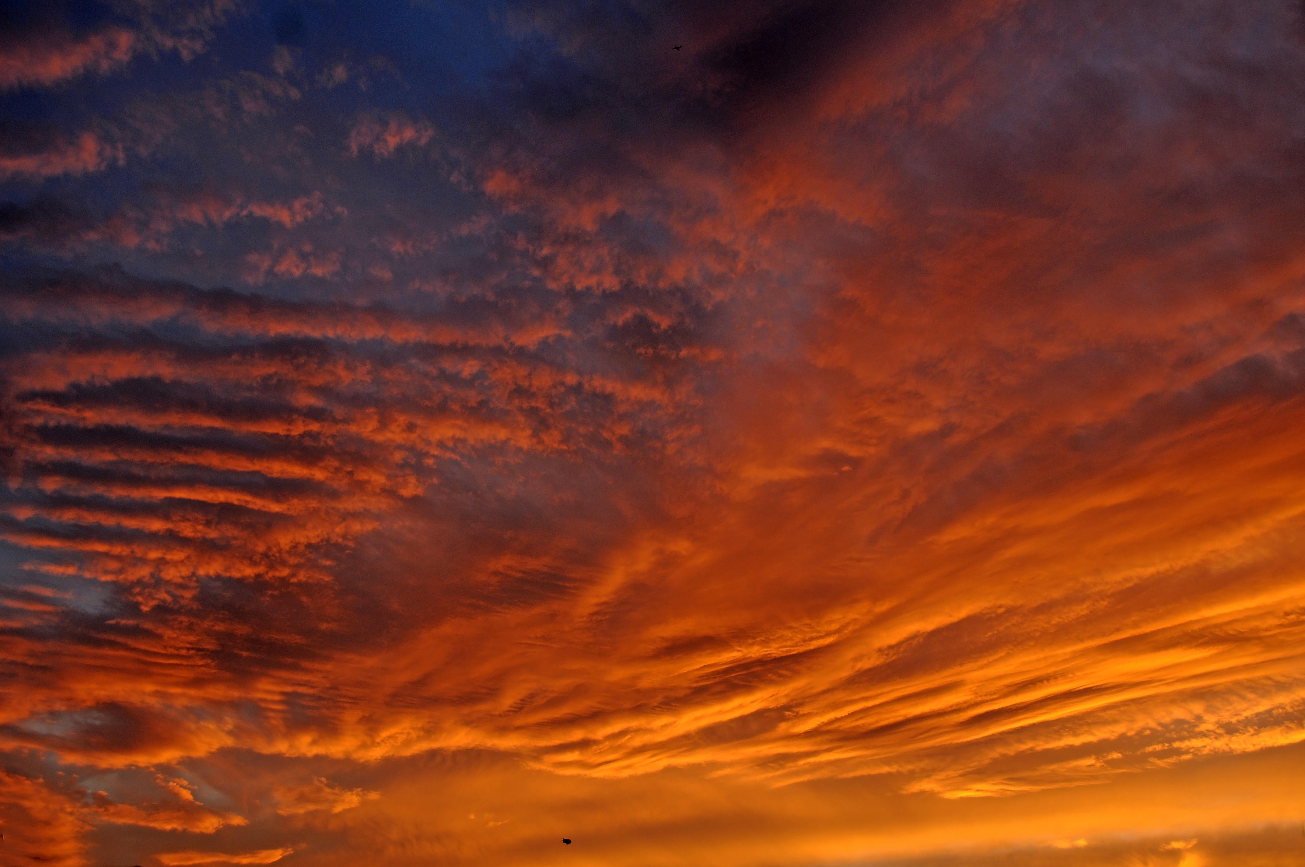 A Blimp on the Low Horizon of a Sunset