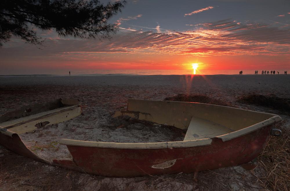 Ruined Rowboat On Beach At Dusk
