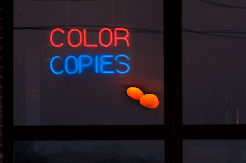 Sunrise reflection in print shop window