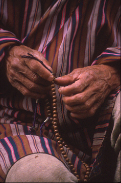 Hands with Buddhists Rosary