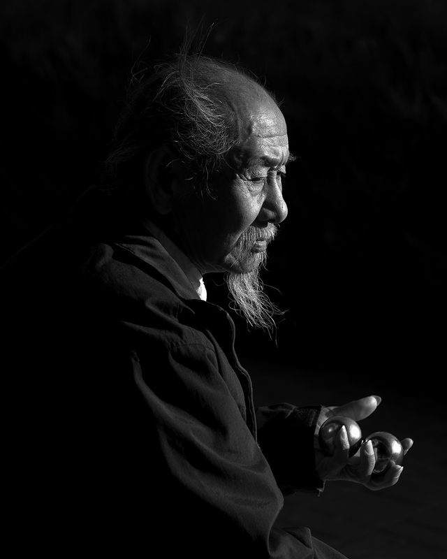 Elderly Chinese man with Baoding balls