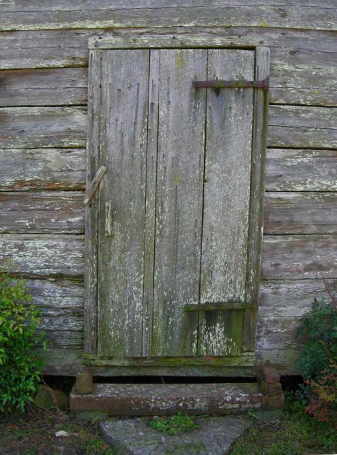 Door to hewn-log shed 4221