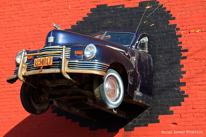 Car in a wall (23716)