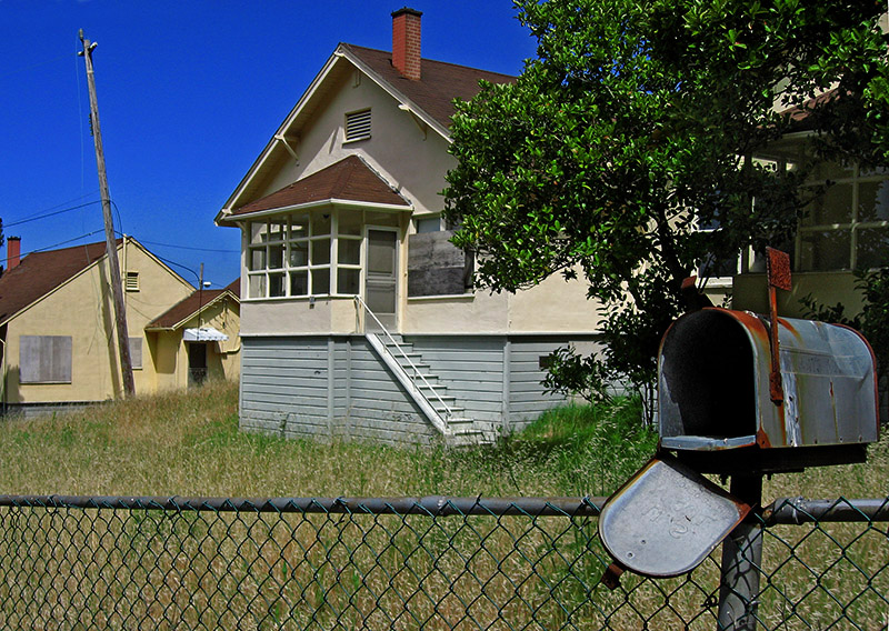 Abandoned mailbox and houses .. 4892