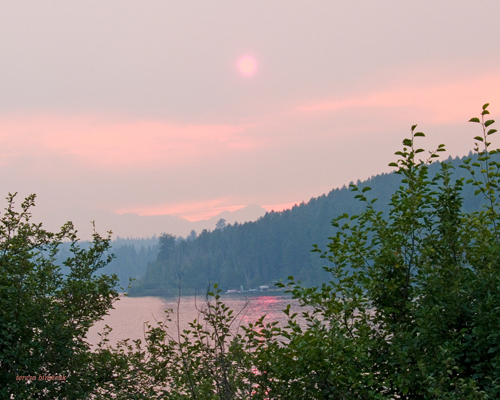 zP1010438 Wildfire-tinted sun at Lake Five near West Glacier Montana.jpg