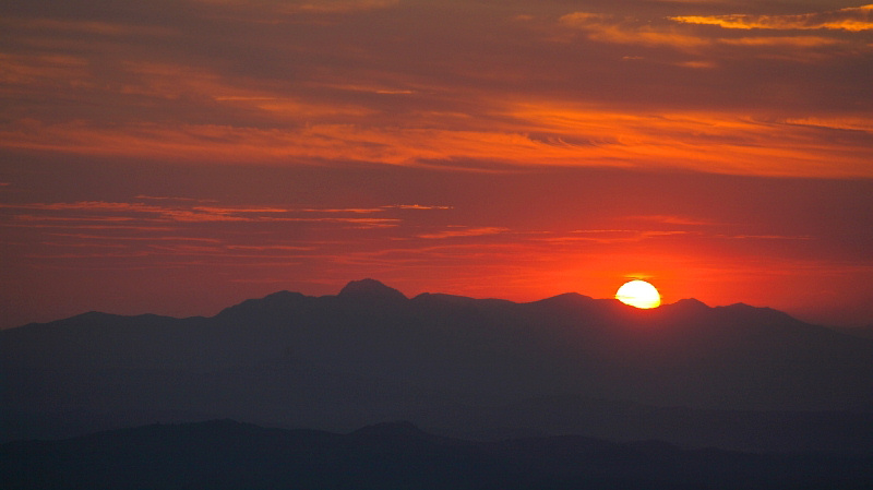 Sun setting behind the mountains