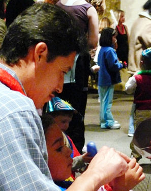 Father and Daughter Checking Raffle Ticket Numbers