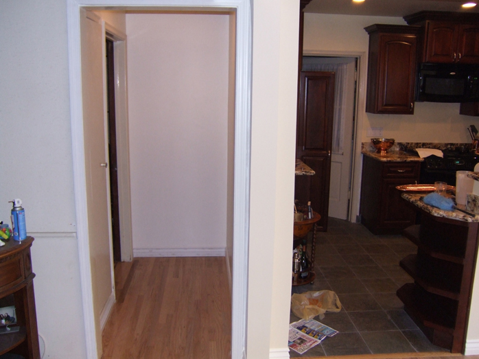 We created a hallway so that the third bedroom no longer opens onto the kitchen, and we didnt lose any real kitchen space.