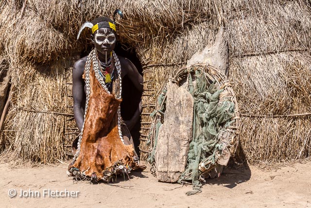 Karo Woman in Doorway to Her Hut
