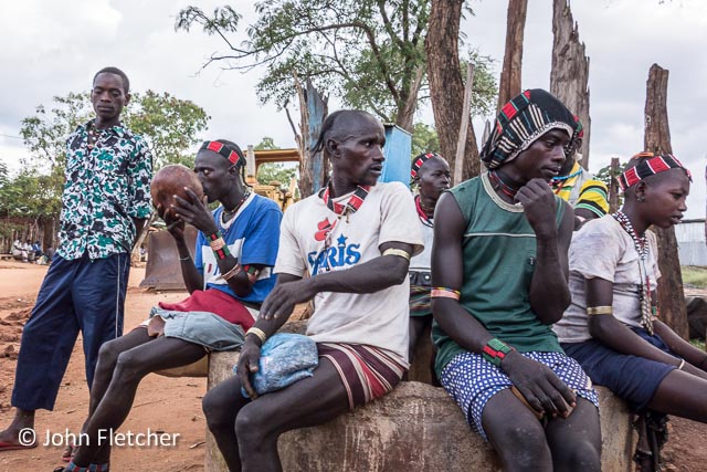 Men Hanging Out at the Market Bar