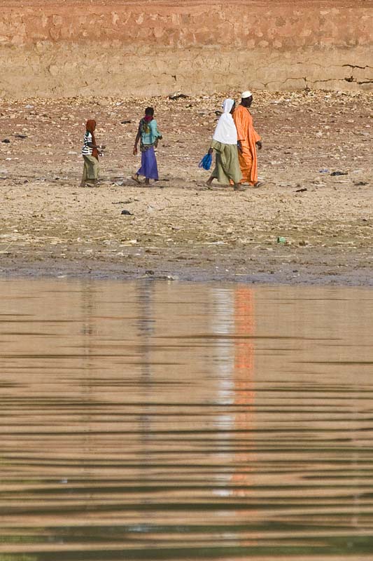 A Family Strolling on the Bani River Bank